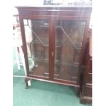 A mahogany china display cabinet with satinwood inlay.