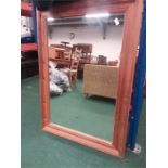 A modern pine framed mirror.