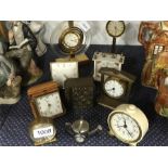 A collection of small clocks.