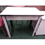 A metal enamelled kitchen table.