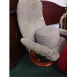 A Stressless reclining easy chair together with a pouffe.