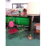 A brass conservatory chair together with a brass two tier table and standard lamp.