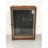 A small wooden display cabinet.