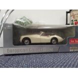 A boxed diecast 1955 Jaguar XK140 scale 1:18.