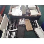 A box containing a quantity of cutlery.