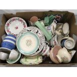 A box of chinaware, including examples of Susie Cooper and Poole Pottery.