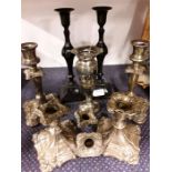 Various candle sticks to include silver plate.