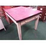 A vintage farmhouse table single drawer to front.