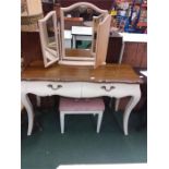 A two drawer dressing table with vanity mirror and stool.