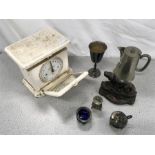 A vintage set of weighing scales, door stop and other metal items.