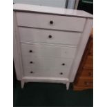 A white painted vintage five drawer chest.