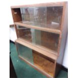 An oak two tier glazed bookcase made by Minty of Oxford.