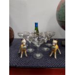 Six Babycham glasses together with a bottle and two ceramic Babycham deer. (Legs have been