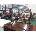 A mahogany vanity mirror with satinwood inlay.