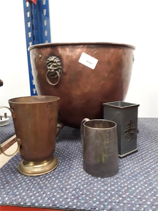 A copper jardiniere and two tankards.