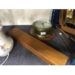 A barometer and brass slide rule in box.