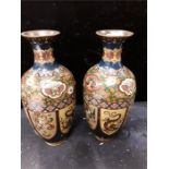 A pair of Chinese Cloisonne vases decorated with dragons (damage to both).