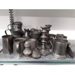 A quantity of pewter tankards etc.