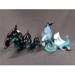 Seven blue glazed Poole Pottery animals to include three dolphins.