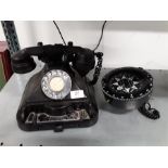 A marine compass and a Bakelite telephone.