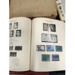 Three stamp albums, a box of world stamps, a number of stamp mounts together with a large box of