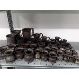 A large quantity of 19th century pewter measures. tankards, pint ,half, gill etc