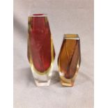 Two red and green cased Italian or bohemian oblong shaped glass vases, of faceted form.