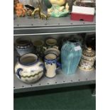 Eleven pieces of European Faience pottery decorated with birds, figures, flowers etc.