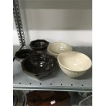 A collection of five studio pottery bowls by J Leach Lowerdown pottery, two in cream and three in