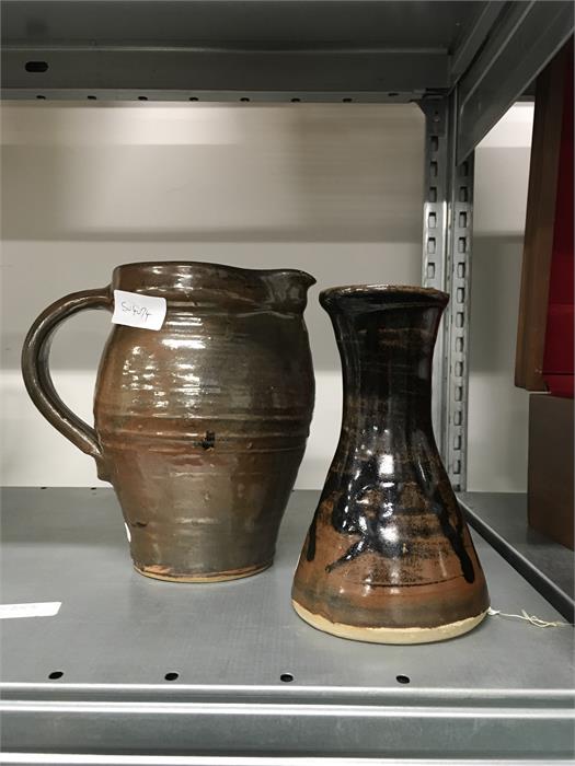 A brown pottery studio tomokue glazed jug by J Leach at Lowerdown, marked TR ML E together with a