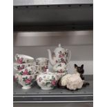 A Wedgwood floral decorated tea set Charnwood 03 together with a Beswick cat and a china sheep.