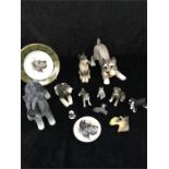 A collection of china dog ornaments, mainly Schnauzers.