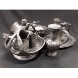 A collection of pewter to include tureens, tappet hen, Art Nouveau basket, ladle, vases etc.