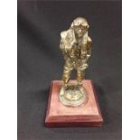 A 12" brass RAF airman/bomber figure.