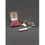 A boxed cigarette lighter together with a silver Queen Victoria brooch, other brooches etc.