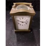 A brass carriage clock.