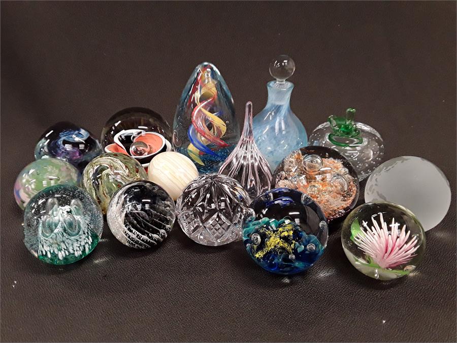 Sixteen various glass paperweights to include Caithness, Isle of Wight etc.