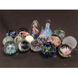 Sixteen various glass paperweights to include Caithness, Isle of Wight etc.