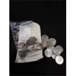 A quantity of various silver coins.