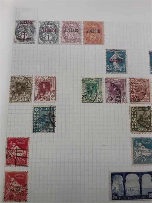 Four albums containing various stamps.