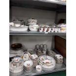 A very large Royal Worcester 'Evesham' china dinner service on two shelves.