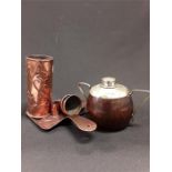A piece of Arts and Crafts Newlyn or Hayle style copper vases, chamber stick, with other copper