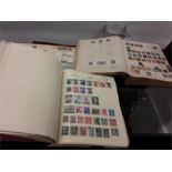 Three stamp albums from various countries.