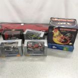 An assorted lot with a metal train kit, a kite, a toy chicken, a Matchbox fire engine (boxed) and