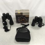 Two pairs of zoom binoculars: Auriol 10-30x60 and Tchibo 8-24x50.