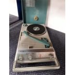 A portable Crown Solid State record player.