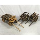 Three model wooden carts.