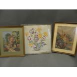 Two woolwork pictures of cottage garden scenes, and a silk embroidery of a vase of flowers,