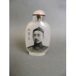 A Peking glass snuff bottle with reverse painted decoration of a gentleman, inscription verso, 3½"