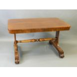 A C19th mahogany centre table, raised on end supports united by a turned stretcher and scrolled